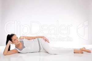 Caucasian young woman lying on the floor