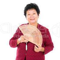 Oriental senior woman with Chinese Fan