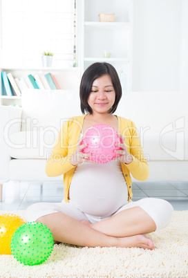 Asian pregnant woman exercising