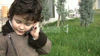Young boy talking on the phone