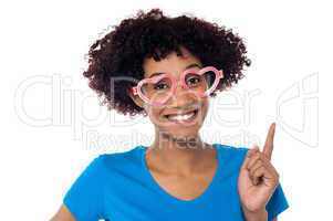 Pretty woman wearing funny heart shaped frame