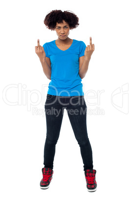 Annoyed young female showing middle finger