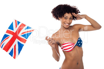 Hot American bikini model saluting and waving UK flag