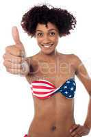 Stars and stripes bikini model showing thumbs up