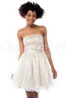 Cheerful glamorous model in white frock