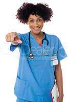 Smiling lady doctor pointing you out