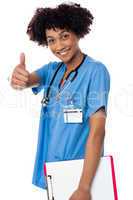 Happy lady doctor showing thumbs up sign
