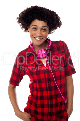 Stylish teenager with headphones around her neck