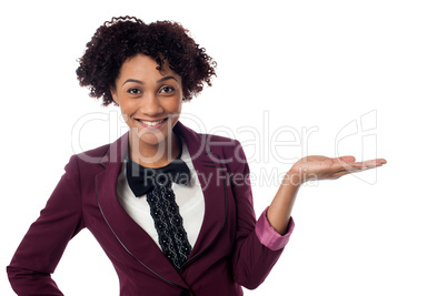 Smiling woman presenting copy space area