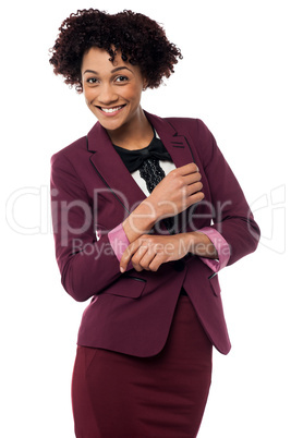 Businesswoman striking stylish pose, confidently