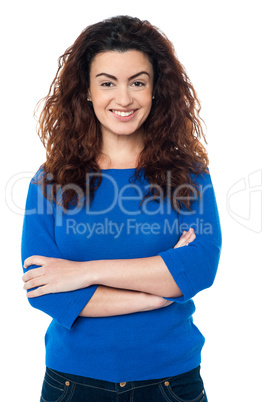 Cheerful woman in trendy blue top and jeans