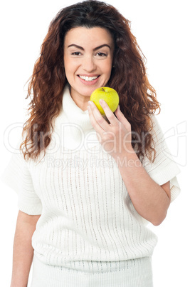 Elegant woman holding fresh green apple