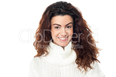 Curly haired woman posing against white