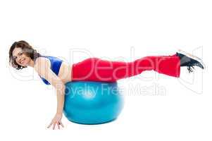 Attractive woman exercising with swiss ball