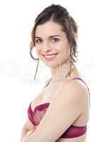 Alluring female model in pink brassiere