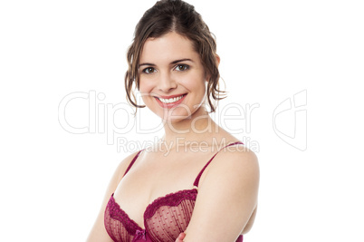 Sensual young woman posing in pink lingerie
