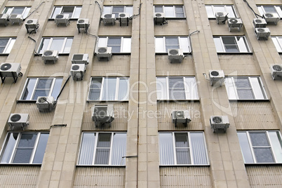 mani air conditioners on the building wall