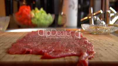 strew salt pepper on beef roulade 10850