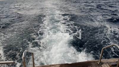 View of the wake behind a moving motor yacht