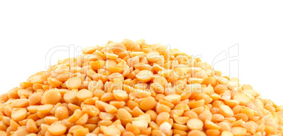 Pile of yellow split peas on white