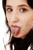 Girl showing tongue.