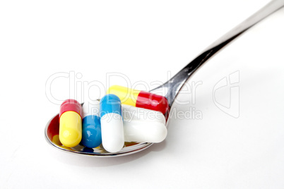 pills on a spoon