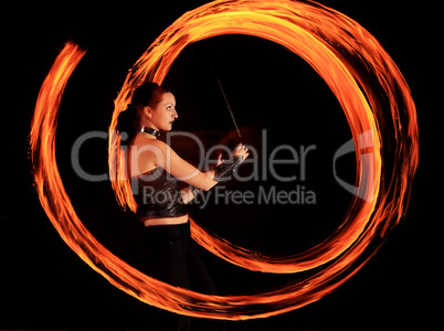 Woman holds in his hand the fire