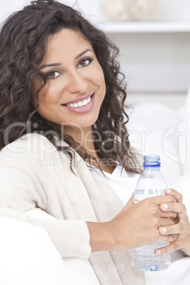 Happy Hispanic Woman Drinking Bottle of Water