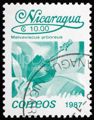 Postage stamp Nicaragua 1987 Turkcap, Malvaviscus Arboreus