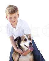 Handsome Young Boy Playing with His Dog Isolated