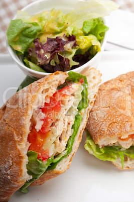 ciabatta panini sandwich with chicken and tomato