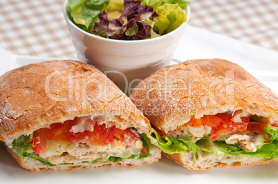 ciabatta panini sandwich with chicken and tomato