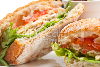 ciabatta panini sandwich with chicken and tomato