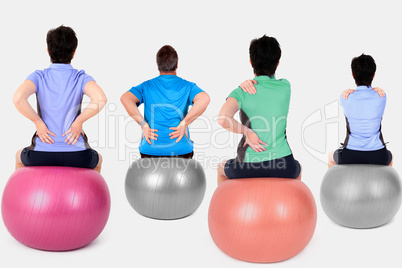 Women and man with exercise ball