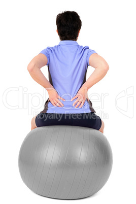 Woman with gym ball doing exercises