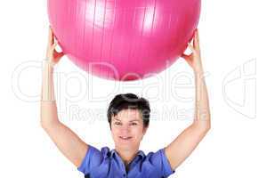 Sporty woman doing exercise with gym ball