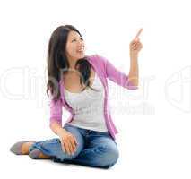 Asian woman hand pointing on blank space