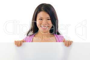 Asian Chinese girl holding placard
