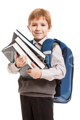 Schoolboy with backpack holding books