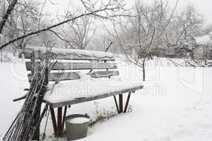 Snow-covered bench