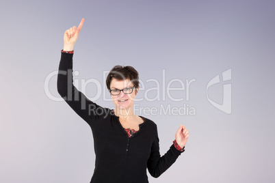 Woman stretched index finger in the air and looking forward