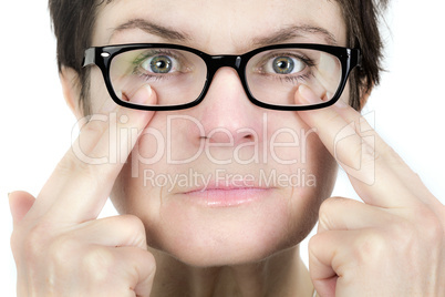 Woman holds her glasses