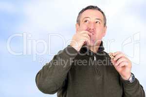 Man eating cookies and licks his fingers