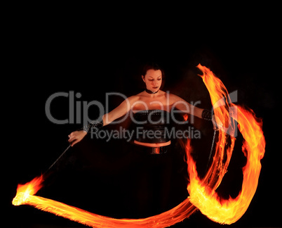 Woman holds in his hand the fire