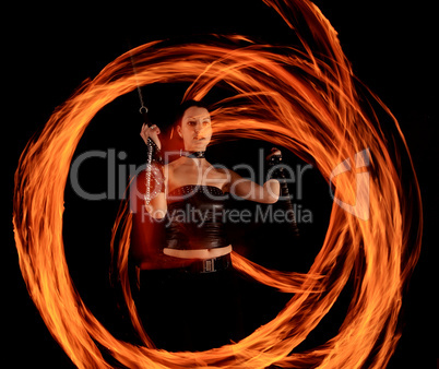 Woman holds in his hand the fire