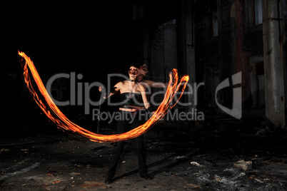 Woman holds in his hand the fire