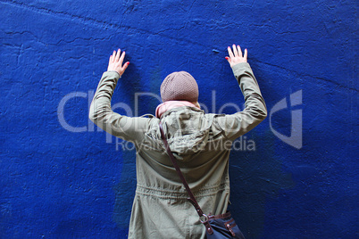 Girl in Front of Blue Wall