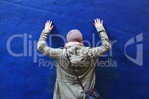 Girl in Front of Blue Wall
