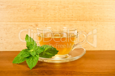 Herbal tea with mint on a wooden board