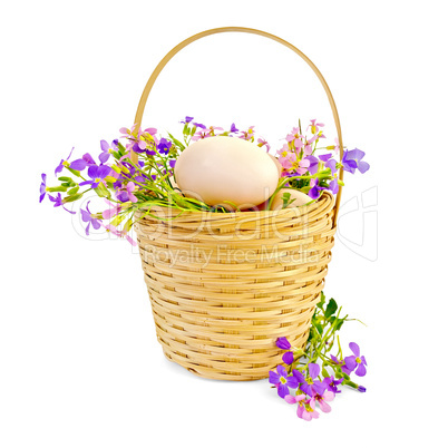 Eggs with flowers in a wicker basket